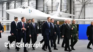 Putin climbs inside a TU-160 nuclear bomber