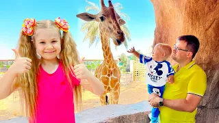 Diana and Roma feed the animals at the Emirates Park Zoo & Resort