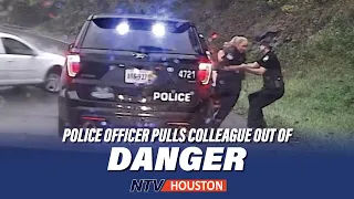 U.S. police officer pulls colleague out of danger from out-of-control car