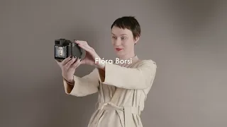 Flóra Borsi tries the Hasselblad X2D 100C for size in her portrait photography