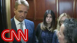 Tearful woman confronts Senator Flake on elevator