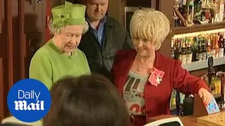 Barbara Windsor shows The Queen around the set of EastEnders in 2001