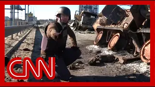 CNN reporter discovers he is crouching by grenade while on air