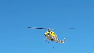 Helicopter firefighting working on fire huey