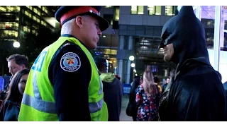 Police officer threatens to arrest Batman in Toronto