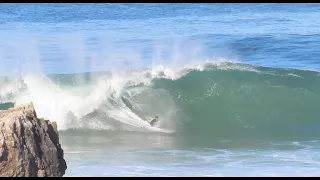 Young surfer João Maria Mendoza trying to catch heavy duty barrels on Tonel