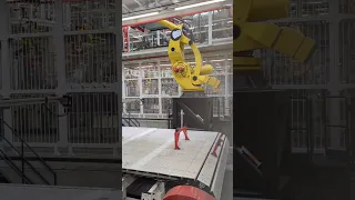 Impressive robot lifting Tesla Model Y at Giga Factory Berlin