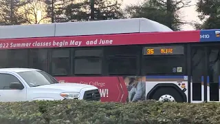 Fax bus 1410 passing by stores on route 35￼