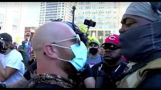 Opposing armed protesters face off over Black Lives Matter