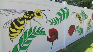 Artist's fence mural inspired by Perrysburg community embraced and admired by residents