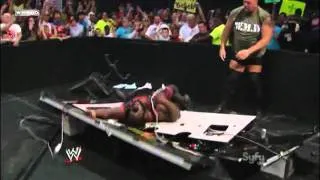 Big Show Chokeslams Mark Henry through the Announcer Table