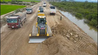Wonderful beautiful Incredible power bulldozer SHANTUI Clearing building road with many land trucks