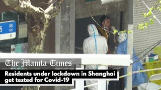 Residents under lockdown in Shanghai get tested for Covid-19