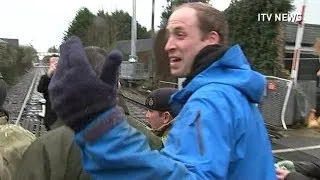 Prince William has a go at journalists after helping flood victims