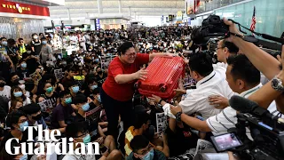 Hong Kong airport protesters block travellers from entering departure gates