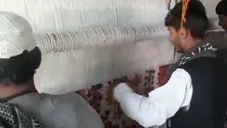 Hand Knotting on Vertical Loom