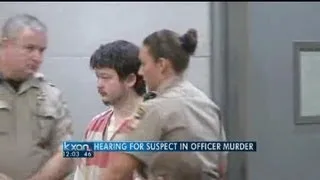 Hearing for suspect in officer murder