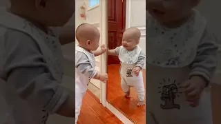 Baby in mirror