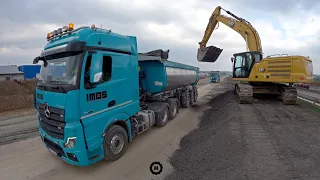 Asphalt loading on highway - Cat and Mercedes