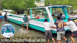 traditional wooden boat launch and test drive