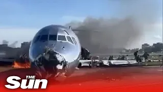 Plane catches FIRE in Miami leaving aircraft charred after crash landing at airport