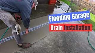 Channel drain installation. Fixing a water issue where the driveway slopes towards the garage.