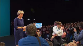 Theresa May interrupted by prankster during televised speech