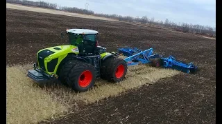 CLAAS XERION 5000 with 10m Lemken Rubin 9