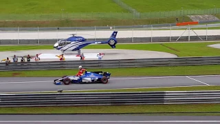 Sebastian Vettel gets a ride from Pascal Wehrlein at Sepang (2017 Formula 1 Malaysian Grand Prix)