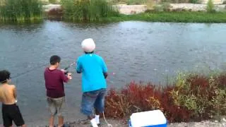 JJ catches a fish.
