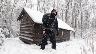 Solo Winter Camping in Mountain Survival Shelter During Snowstorm