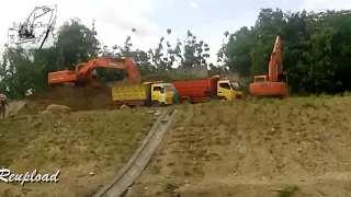 extreme TWIN DOSSAN EXCAVATOR LOADING TO DUMP TRUCK IN THE DOWN HILL