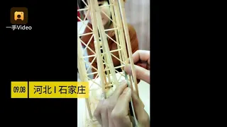 Check out the miniature of Eiffel Tower made from bamboo sticks and disposable chopsticks!