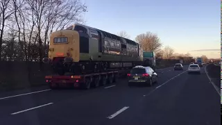 Class 55 Deltic D9016 Gordon Highlander being transported north on M6 Staffordshire