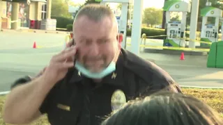 The emotional moment a police officer learns a baby is found safe during an Amber Alert