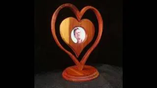 Make a heart-in-a-heart picture frame with wood. Awww...it's cute.
