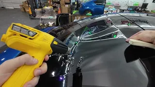 Tinting a tall back window by pulling the film