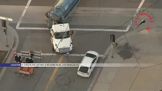 Police chase stolen tanker truck carrying 2,000 gallons of unknown liquid in Mid-Wilshire area of LA