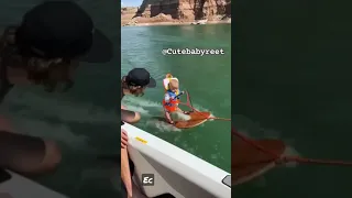 Baby Surfing in water