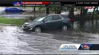 Cars stall in flood waters in Kenner