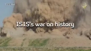 ISIS vandals smash up ancient sites in war on history