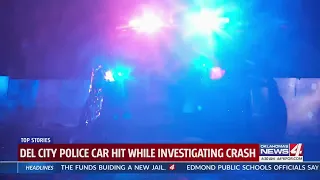 Del City police car hit while investigating crash