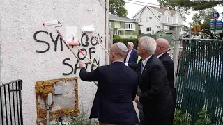Officials paint over "Synagogue of Satan" hate speech graffiti on Yeshiva at unity rally