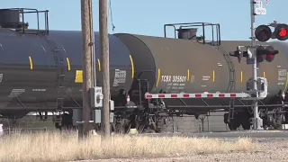 What should you do if your car gets stuck on railroad tracks?