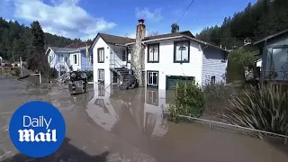 Residents survey damage after flooding rocks Northern California