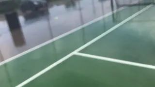 Playing tennis in the rain