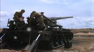 A soldier gives a signal to fire and other soldiers load an M107 Self Propelled 1...HD Stock Footage