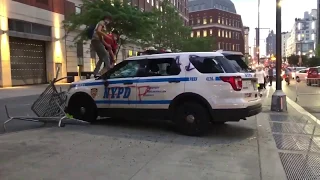 Protesters stomp on NYPD car, smash windows with feet
