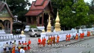Luang Prabang, Laos - Monks passing Wat Sene Souk