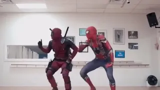 Deadpool and Spiderman dancing to Christmas music